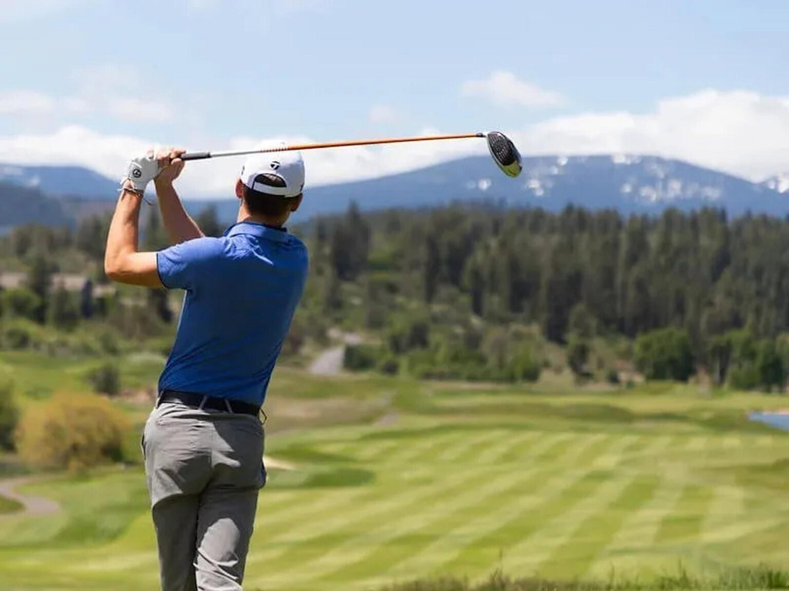 Adventure golf at Running Y Resort with scenic mountain views.