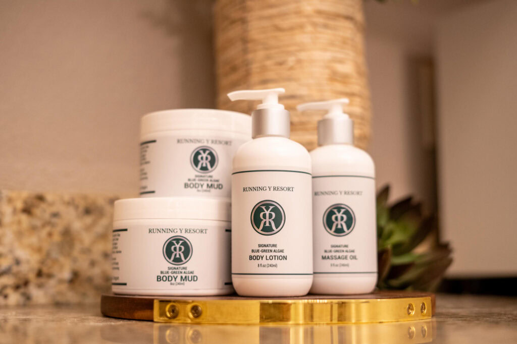 Luxurious spa products at Running Y Resort, including body mud, lotion, and massage oil.
